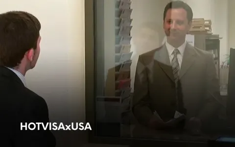 Заявник на співбесіді біля віконця візового офіцера США